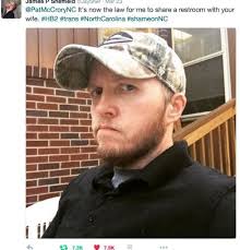 A White transgender man poses for the camera to protest discriminatory...