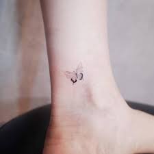 Tiny blue butterfly tattoo on wrist. 36 Cute And Lovely Butterfly Tattoos