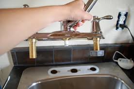Some kitchen faucets have a separate sprayer hose on the side. How To Replace A Kitchen Sink Faucet Handiworker S Guide