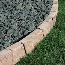 Steel landscape edging keeps a clean line between grass and flower beds. Insignia 9 In L X 5 In W X 3 In H Concrete Straight Edging Stone Lowes Com Edging Stones Stepping Stone Pathway Stone Pathway