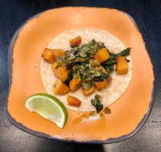 With slaw, cilantro, cotija, & sriracha crema ‑ pineapple habanero salsa on the side: Sacramento Vegan Mas Taco Bar