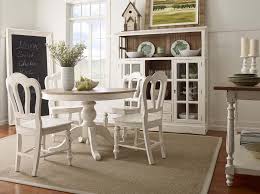Wood furniture painted in bright pastel colors or white or stained with a natural finish gives the home a welcoming feel. Farmhouse Round Pedestal Table
