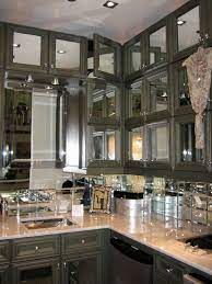 Add class and elegance to your cupboards, cabinets, and furniture by choosing from several styles of glass; Mirrored Kitchen Cabinets With Regard To Your Home Throughout Mirrored Kitchen Cabinet Doors Plac Mirror Backsplash Kitchen Kitchen Mirror Kitchen Decor Modern