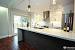 Farmhouse White Kitchen With Dark Island
