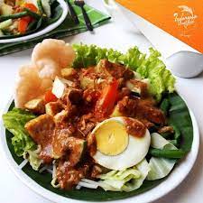 Gado Gado Also Known As Lotek Sundanese And Javanese Is An Indonesian Salad Of Slightly Boiled Blanched Or Steame Fried Tofu Steamed Vegetables Rice Wraps