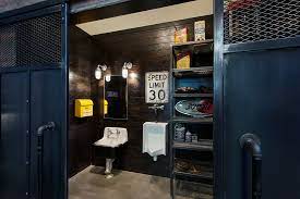 Consider stone and brick faux wall panels or an actual stone wall. Custom Man Cave Industrial Bathroom Calgary By Rockcreek Builders Houzz