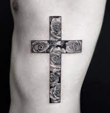 An ornate tattoo that cradles a small bright heart at the center, while a rose in full bloom carries the skillfully crafted cross. Pin On Steve Tats