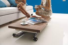 Drill holes that are approximately 0.25 inches (0.64 cm) deep into the bottom of the table legs, then hammer in tee nuts. 50 Incredible Adjustable Height Coffee Table Converts To Dining Table Ideas On Foter