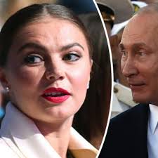 Vladimir putin's girlfriend alina kabaeva gave birth a couple of weeks ago, according to swiss newspaper reports. Has Vladimir Putin Got A Secret Family Mystery Lover Pictured With Wedding Ring Daily Star