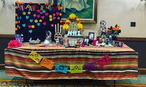 Scattered from altar to gravesite, marigold petals guide wandering souls back to their place of rest. Nhi Familia Invited To Share Dia De Los Muertos Remembrances