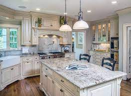 Using white cabinets in the kitchen is a smart design move, as they'll give the space a light and airy feeling. 26 Gorgeous White Country Kitchens Pictures Country Kitchen Designs Country Kitchen Cabinets Antique White Kitchen