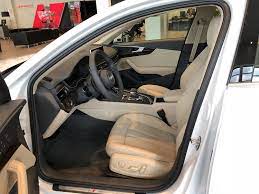 Ibis White With Tan Interior On The 2018 Audi A4 Front Row Seat And Steering Wheel View Vehicle Located At Audi Of Bridgewater Audi Dealership Audi Vehicles