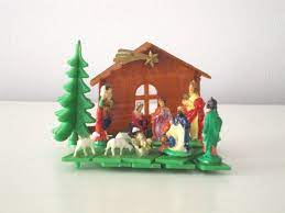 A small manger rests on top of a smart phone. Pin On Christmas Vintage Vintagechristmas