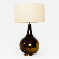 The dimple effect of the glass base adds a subtle touch of texture to your space. Gold And Yellow Mercury Glass Table Lamp