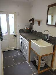 With a failing structural system, the existing cottage had a very low sloping roof. Belfast Sink Farmhouse Laundry Room Laundry Room Makeover Laundry Room Sink