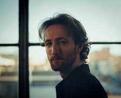 Experience the haunting narrative of Elliot Greer's "This Town" song