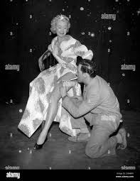 Glamourous Showgirl Susan Irvin to play in American Musicial The Pajama  Game at London Coliseum wears the garter instead of having pockets to keep  her lighter handy for smoking a cigarette The
