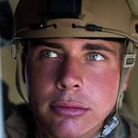 US Marine Corps Reserve (USMCR) Corporal (CPL) Paul Garner, assigned to  Kilo/Company, 3rd Battalion, 23rd Marine Regiment, augmented to the 4th  Civil Affairs Group (CAG), carries his 5.56mm M16A2 rifle, as he