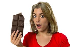 Pretty Happy and Excited Girl Holding Big Chocolate Bar in Sugar Addiction  Temptation Looking Guilty Skipping Diet in Unhealthy Nu Stock Photo
