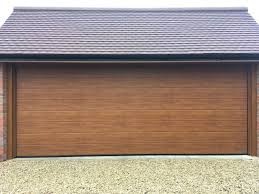 Hormann Sectional Garage Door In Golden Oak Beautiful Colour For A Stylish Modern Garage Door Swr Garage Doors Sectional Garage Doors Hormann Garage Doors