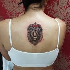 In A Colored Or Monochromatic Tattoo Version Small Lion Tattoo On Back Back Tattoo Small Lion Tattoo Lion Tattoo