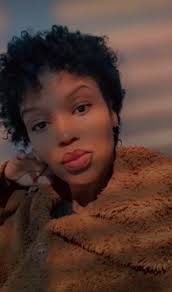 Global icon Denzel Washington's daughter, Katia Washington, and her spouse,  Colleen Wilson, made headlines for flipping traditional gender  expectations. The 6'4" person in the elegant dress is a trans woman  (Biological Man).