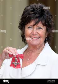 After collecting her mbe from the queen hi-res stock photography and images 