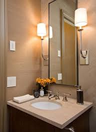 A modern space with grey marble tiles, white cabinets, black frame glass door and faucets. 10 Must Have Bathroom Accessories