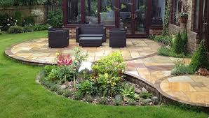 A perfect addition to your outdoor living is a seating wall surrounding a firepit. Patio Design And Natural Stone Walling Landscape Garden Designers Reading Berkshire Pete Sims