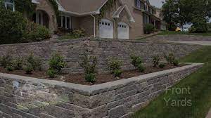 This hillside landscaping idea makes use of a front deck instead. Tackling A Sloping Yard Design Ideas And Solutions Youtube
