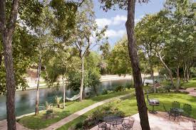 The landscaped grounds feature 330 feet of grassed river front with three separate stairways into the spring fed comal river. Home
