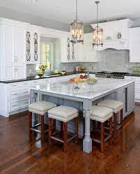 Adding a kitchen island or cart with stools to your home is also an easy way to make an extended eating area or a cocktail bar. Incorporating Seating Into A Kitchen Island Normandy Remodeling