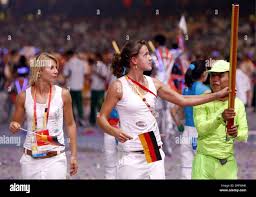 German Team with hockey players Eileen Hoffmann (L) and Janne  Mueller-Wieland enters the Stadium during the Closing Ceremony of Beijing  2008 Olympic Games at National Stadium, Beijing, China, 24 August 2008.  dpa