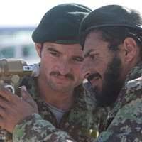 Coalition Forces attend a memorial service in honor