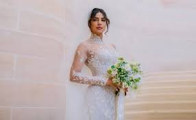 Ralph Lauren Discusses Priyanka Chopra S Wedding Dress Nick jonas, 26, and priyanka chopra's, 36, first official wedding photos have been unveiled priyanka chopra stuns in a red lehenga and white ralph lauren gown decorated with two and this breathtaking dress certainly didn't disappoint. ralph lauren discusses priyanka chopra