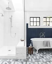 Find ideas and inspiration for clawfoot tub shower to add to your own home. White Clawfoot Bathtub In Front Of Blue Shiplap Clad Wall Transitional Bathroom