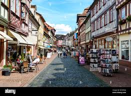 8 August 2019: Street with colorful half-timbered houses, peaple ...