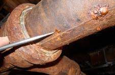 Keep in mind the putty is what will stop the leak, the wrap will harden and hold the putty in place. How Can I Repair A Nail Head Size Leak On A Vertical Cast Iron Sewer Pipe In My Basement Home Improvement Stack Exchange