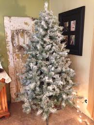 I agree 100% on the flocking. Flocked Christmas Tree Couple Of Cans Of White Spray Paint 1 Each And 2 Cans Of Snow From The Dollar Gene Flocked Christmas Trees Christmas Christmas Diy