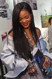 The 'we found love' singer was walking arm in arm with a friend wearing a short leather skater skirt and backward turned baseball cap. Robyn Rihanna Fenty Rihanna Straight Hairstyles Virgin Brazilian Straight Hair