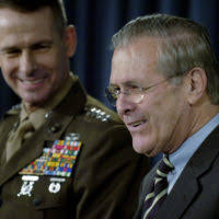 U.S. Marine Corps GEN. Peter Pace, (right) Vice Chairman of the Joint  Chiefs of STAFF, responds to a reporters question while The Honorable  Donald H. Rumsfeld, U.S. Secretary of Defense, listens during