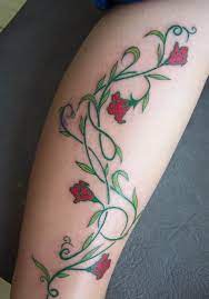 This tattoo done in black and grey stands out because of the vines that grow around the rose. 33 Awesome Vine Tattoos