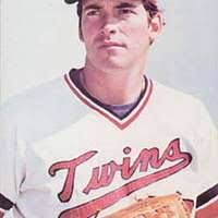A brown and white dog wearing a white feather hat. Dog australian shepherd  funny.