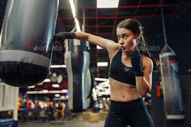 Woman In Boxing Bandages Hits A Punching Bag Box Punching Bag Female Boxers Women