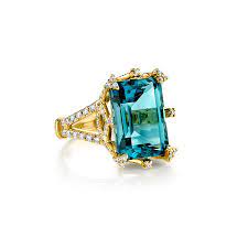 It is accompanied by 0.60 carats or round brilliant cut diamonds set inn18k white and yellow gold. Sloane Street Yellow Gold Blue Topaz Diamond Ring Ss R012c Lb Wdcb Y
