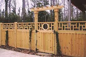 The pickets are on both sides of the fence. Wood Board And Batten With Arbor Over Gate Fence Gate Gate Arbor Types Of Fences