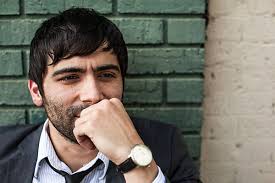 A Man With Dark Hair And Beard Smiling And Looking Down" by Stocksy  Contributor "J Danielle Wehunt"