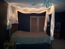 That way, you can pull them open and closed around your bed to control light and sound. Diy Bed Light Canopy Canopy Bed Diy Bedroom Ideas Pinterest Canopy Bedroom