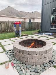 A stylish addition to any backyard space with customizable rock & stucco bases. Diy Patio With Grass Between Pavers And A Fire Pit