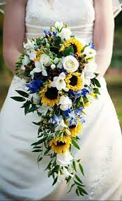 Sunflower wedding bouquet with white gerbera daisies and white roses. Beautiful Cascading Wedding Bouquet White Roses White Freesia Yellow Sunflowers Sunflower Wedding Bouquet Yellow Wedding Bouquet Cascading Wedding Bouquets